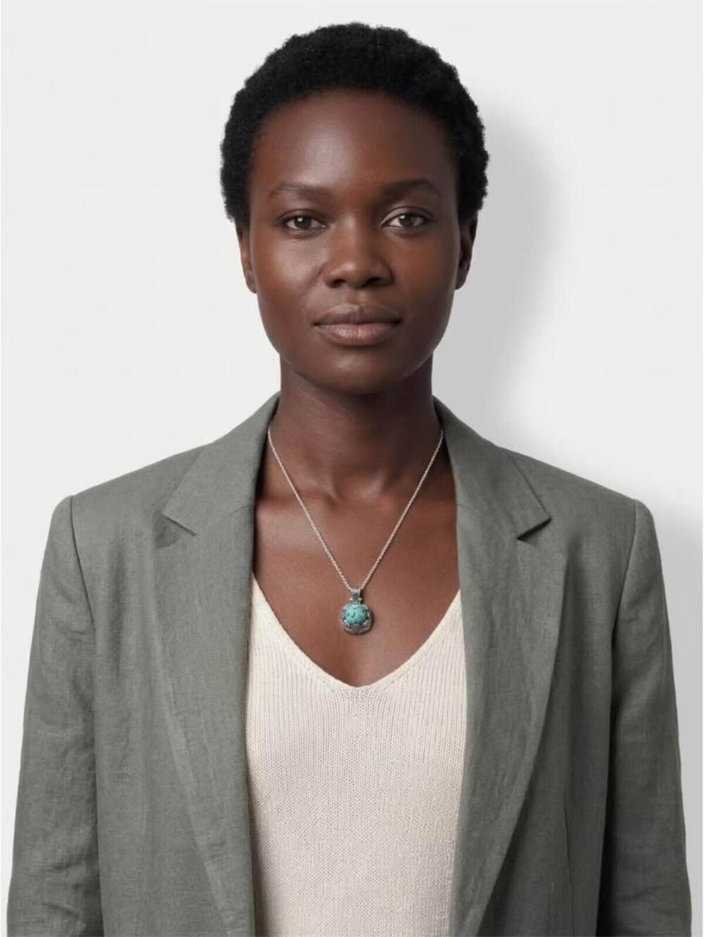 Silver tone chain necklace with turquoise color pendant